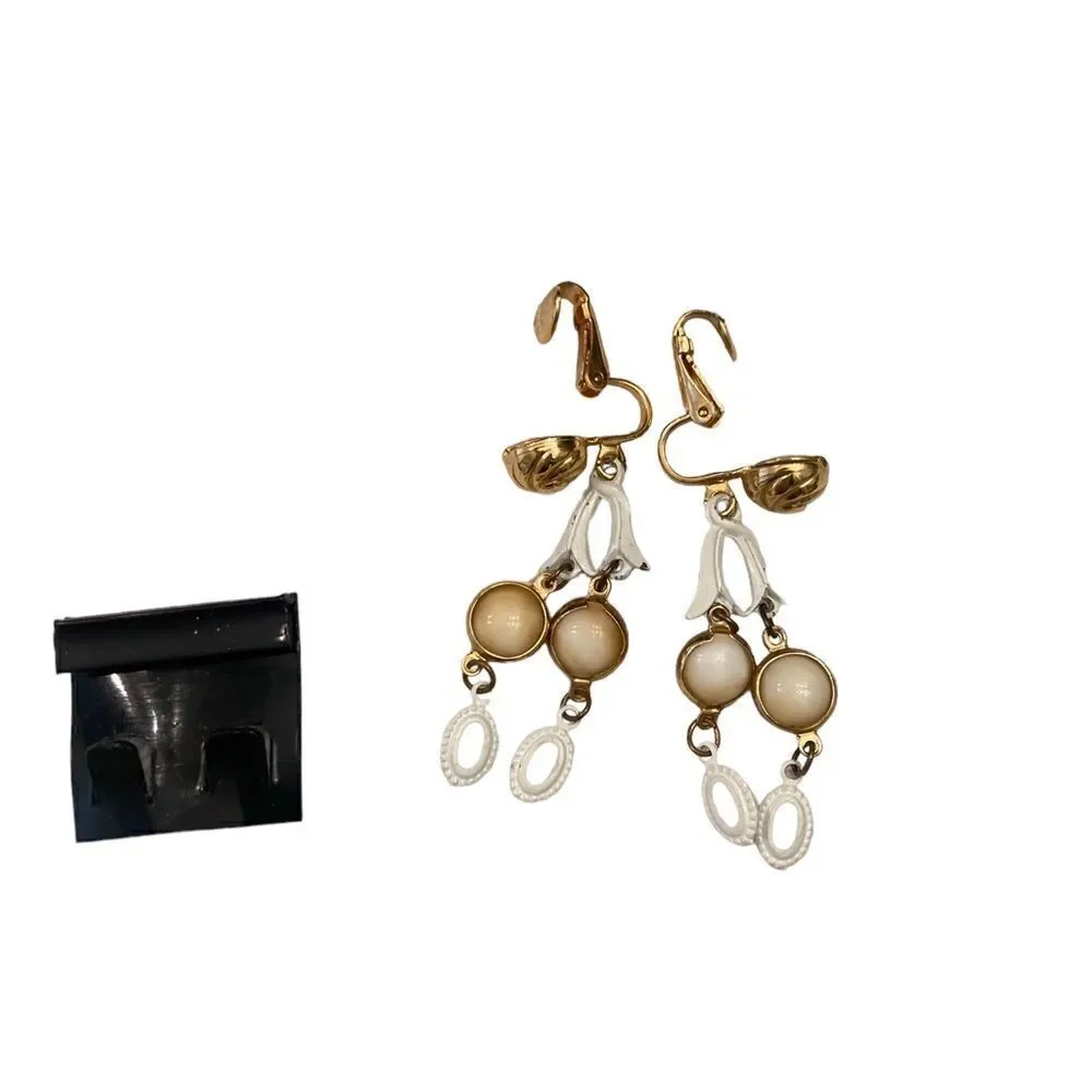 New Vintage 1990’s soft clip on drop earrings gold tone swirl & white enamel
